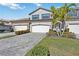 Two-story home with three-car garage and paver driveway at 5830 Wake Forest Run # 102, Bradenton, FL 34211