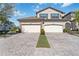 Two-story home with three-car garage and paver driveway at 5830 Wake Forest Run # 102, Bradenton, FL 34211