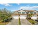 Beautiful two-story home with two-car garage and lush landscaping at 5830 Wake Forest Run # 102, Bradenton, FL 34211