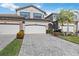Two-story home with three-car garage and paver driveway at 5830 Wake Forest Run # 102, Bradenton, FL 34211