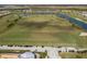 Aerial view of golf course with driving range and parking area at 5830 Wake Forest Run # 102, Bradenton, FL 34211