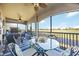 Spacious screened lanai with outdoor seating and golf course views at 5830 Wake Forest Run # 102, Bradenton, FL 34211