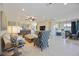 Open concept living space with views into kitchen and dining area at 5830 Wake Forest Run # 102, Bradenton, FL 34211