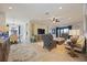 Spacious living room with ample seating and large TV at 5830 Wake Forest Run # 102, Bradenton, FL 34211