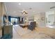 Bright living room with a cozy seating arrangement and access to a balcony at 5830 Wake Forest Run # 102, Bradenton, FL 34211