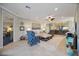 Open living area with a view into a bedroom and access to other rooms at 5830 Wake Forest Run # 102, Bradenton, FL 34211