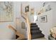 Elegant staircase with white railing and carpeting at 5830 Wake Forest Run # 102, Bradenton, FL 34211