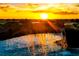 Stunning waterfall cascading into a refreshing pool at sunset at 5830 Wake Forest Run # 102, Bradenton, FL 34211