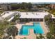 Community pool and surrounding buildings from above at 5973 Terrace Park N Dr # 208, St Petersburg, FL 33709