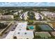 Complex overview featuring tennis courts and pool at 5973 Terrace Park N Dr # 208, St Petersburg, FL 33709