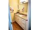 Well-appointed bathroom with granite vanity and updated fixtures at 5973 Terrace Park N Dr # 208, St Petersburg, FL 33709