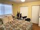 Bright bedroom featuring a comfortable bed and ample closet space at 5973 Terrace Park N Dr # 208, St Petersburg, FL 33709