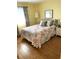 Guest bedroom with a queen-size bed at 5973 Terrace Park N Dr # 208, St Petersburg, FL 33709