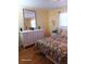 Bedroom with dresser and large mirror at 5973 Terrace Park N Dr # 208, St Petersburg, FL 33709