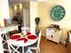 Dining area with round table and white chairs at 5973 Terrace Park N Dr # 208, St Petersburg, FL 33709