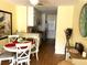 Dining area with round table and kitchen view at 5973 Terrace Park N Dr # 208, St Petersburg, FL 33709