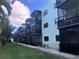 Building exterior showcasing a row of condo units at 5973 Terrace Park N Dr # 208, St Petersburg, FL 33709