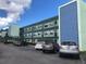 Multi-story condominium with balconies, secure entry, and ample parking at 5973 Terrace Park N Dr # 208, St Petersburg, FL 33709