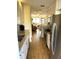Eat-in kitchen boasting stainless steel appliances and ample cabinet space at 5973 Terrace Park N Dr # 208, St Petersburg, FL 33709