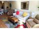 Living room with hardwood floors and seating area at 5973 Terrace Park N Dr # 208, St Petersburg, FL 33709