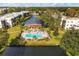 Community pool and gazebo near a lake at 5973 Terrace Park N Dr # 208, St Petersburg, FL 33709