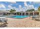 Community pool with plenty of seating at 5973 Terrace Park N Dr # 208, St Petersburg, FL 33709