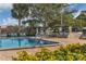 Refreshing community pool with lounge chairs at 5973 Terrace Park N Dr # 208, St Petersburg, FL 33709
