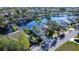 Charming waterfront home nestled amongst mature trees featuring a serene view of the adjacent lake at 603 47Th E St, Bradenton, FL 34208