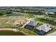 Beautiful home with a screened-in pool and scenic lake view at 624 Blue Shell Loop, Sarasota, FL 34240
