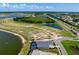 Scenic aerial view of a luxurious home with pond and scenic views at 624 Blue Shell Loop, Sarasota, FL 34240