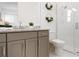 Elegant bathroom with modern fixtures, a walk-in shower, and stylish decor at 624 Blue Shell Loop, Sarasota, FL 34240