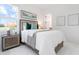 Cozy bedroom with a comfortable bed, nightstands, and a scenic view at 624 Blue Shell Loop, Sarasota, FL 34240