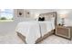 Serene bedroom featuring soft lighting, a plush bed, and contemporary decor at 624 Blue Shell Loop, Sarasota, FL 34240