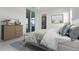 Nicely decorated bedroom with area rug and a view of the backyard at 624 Blue Shell Loop, Sarasota, FL 34240