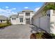 Elegant two-story home with a three-car garage and a well-manicured front yard at 624 Blue Shell Loop, Sarasota, FL 34240