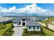 Stunning lakefront home with lush landscaping and beautiful architectural details at 624 Blue Shell Loop, Sarasota, FL 34240