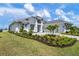 Charming single-Gathering home with lush landscaping and a well-manicured lawn at 624 Blue Shell Loop, Sarasota, FL 34240
