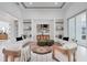 Inviting living room showcasing contemporary design, recessed lighting, and open access to other living spaces at 624 Blue Shell Loop, Sarasota, FL 34240