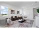 Inviting living room with a comfortable sofa, accent chairs, and natural light at 624 Blue Shell Loop, Sarasota, FL 34240