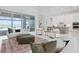 Open-concept living room offering expansive views, a modern kitchen, and contemporary design elements at 624 Blue Shell Loop, Sarasota, FL 34240