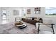 Stylish living room featuring modern furnishings, bright windows, and an open, airy design at 624 Blue Shell Loop, Sarasota, FL 34240
