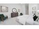 Bright main bedroom featuring neutral tones, tray ceilings, and natural light from a large window at 624 Blue Shell Loop, Sarasota, FL 34240