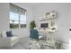 Bright office with a work station, natural light, and a comfortable white chair at 624 Blue Shell Loop, Sarasota, FL 34240