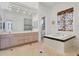 Primary bathroom with double vanity, soaking tub, and separate shower at 6700 S Gator Creek Blvd, Sarasota, FL 34241