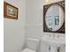 Stylish bathroom with pedestal sink, oval mirror, and updated fixtures at 6700 S Gator Creek Blvd, Sarasota, FL 34241
