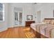 Bright bedroom with french doors leading to patio, hardwood floors and lots of light at 6700 S Gator Creek Blvd, Sarasota, FL 34241