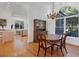 Elegant dining room featuring hardwood floors and a charming chandelier at 6700 S Gator Creek Blvd, Sarasota, FL 34241