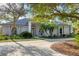 Luxury home with circular driveway and lush landscaping at 6700 S Gator Creek Blvd, Sarasota, FL 34241