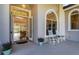 Inviting front porch with rocking chairs and view into the home at 6700 S Gator Creek Blvd, Sarasota, FL 34241
