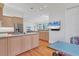 Open kitchen with breakfast bar, stainless steel appliances, and views to living area at 6700 S Gator Creek Blvd, Sarasota, FL 34241